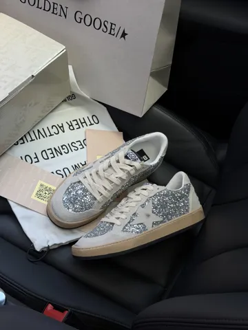 Golden Goose Ball Star in silver glitter with ice-gray suede inserts